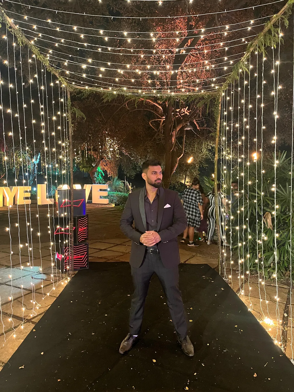 Fairy light tunnel entrance at an evening celebration at Yeshwant Hall